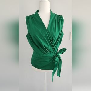 Eva Mendez , New York and Company Green sleeveless wrap around top.